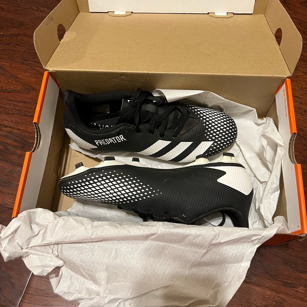 Black and white soccer cleats
